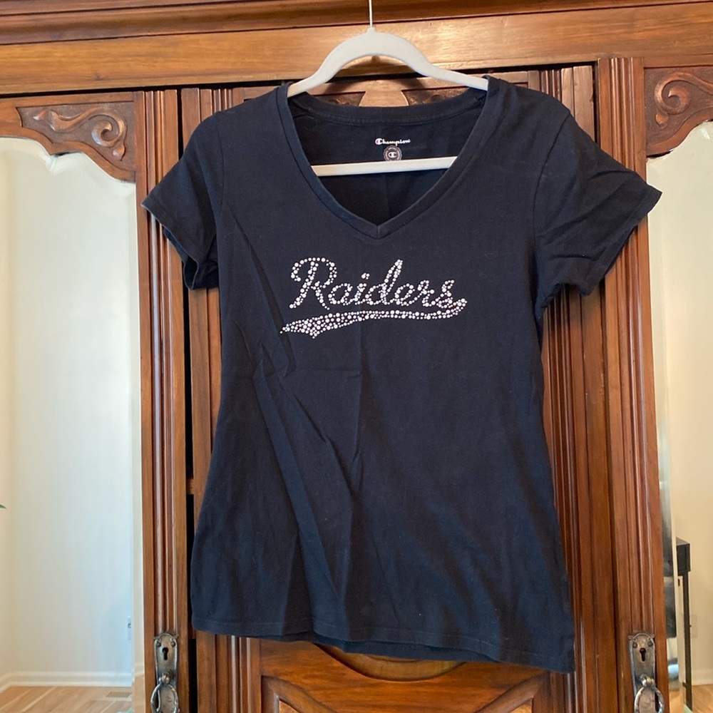 Black short sleeve T-shirt says raiders